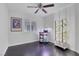 Bright bedroom with a ceiling fan, storage cart and hydroponic growing system at 4420 Loma Ct, Las Vegas, NV 89130