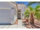 Inviting front entrance with a charming exterior and mature landscaping for added curb appeal at 4420 Loma Ct, Las Vegas, NV 89130