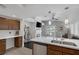 Open kitchen featuring stainless steel appliances, a breakfast bar, and seamless flow to the living area at 4420 Loma Ct, Las Vegas, NV 89130