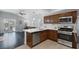 Modern kitchen with stainless steel appliances, countertops, and ample natural light at 4420 Loma Ct, Las Vegas, NV 89130