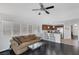 Inviting living room with a comfortable sofa and an open view into the modern kitchen at 4420 Loma Ct, Las Vegas, NV 89130