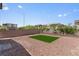 Large backyard with a patch of artificial turf at 4498 Lantern Point Ave, North Las Vegas, NV 89084