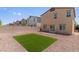 A view of the xeriscaped backyard with an artificial turf area at 4498 Lantern Point Ave, North Las Vegas, NV 89084