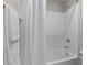 Bright bathroom featuring a shower over the tub, and white subway tile at 4498 Lantern Point Ave, North Las Vegas, NV 89084