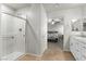 This bathroom has a glass shower door and a view of the bedroom at 4498 Lantern Point Ave, North Las Vegas, NV 89084