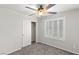 Bedroom featuring a ceiling fan and shuttered window at 4498 Lantern Point Ave, North Las Vegas, NV 89084