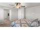 This bedroom has a ceiling fan, neutral walls and carpet flooring at 4498 Lantern Point Ave, North Las Vegas, NV 89084