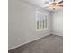 This bedroom has a window with shutter blinds and gray carpet at 4498 Lantern Point Ave, North Las Vegas, NV 89084