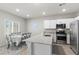 Bright eat-in kitchen with white cabinets and stainless steel appliances at 4498 Lantern Point Ave, North Las Vegas, NV 89084