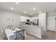 Eat-in kitchen featuring a peninsula counter and a modern dining set at 4498 Lantern Point Ave, North Las Vegas, NV 89084