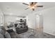 Bright open-concept living room with ceiling fan and dining area at 4498 Lantern Point Ave, North Las Vegas, NV 89084