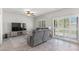 Comfortable living room with a TV, plush seating, and lots of natural light at 4498 Lantern Point Ave, North Las Vegas, NV 89084