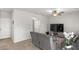 Cozy living room with a ceiling fan, television, and comfortable seating at 4498 Lantern Point Ave, North Las Vegas, NV 89084