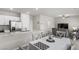 Open-concept living space featuring a modern kitchen with granite countertops and a dining area at 4498 Lantern Point Ave, North Las Vegas, NV 89084