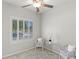 Bright sitting room with plantation shutters, neutral decor, and cozy seating at 4498 Lantern Point Ave, North Las Vegas, NV 89084