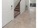 Entryway featuring a carpeted staircase and tile flooring, leading to the upper level at 4498 Lantern Point Ave, North Las Vegas, NV 89084