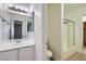 Clean bathroom featuring a vanity, shower/tub combination with sliding door, and modern fixtures at 4683 Monterey Cir # 4, Las Vegas, NV 89169