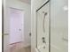 Clean bathroom with shower featuring chrome fixtures, white wall tiles, and neutral tones at 4683 Monterey Cir # 4, Las Vegas, NV 89169
