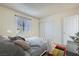 Comfortable bedroom featuring a closet, window, and soft decor at 4683 Monterey Cir # 4, Las Vegas, NV 89169