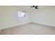Well-lit bedroom features new flooring, window, and ceiling fan at 4683 Monterey Cir # 4, Las Vegas, NV 89169