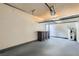 Spacious garage with painted walls and grey flooring offers ample storage and parking space at 4683 Monterey Cir # 4, Las Vegas, NV 89169