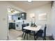Kitchen with dining nook, modern appliances, and new floors at 4683 Monterey Cir # 4, Las Vegas, NV 89169