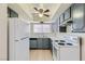 Well-maintained kitchen with modern appliances, ample counter space, and ceiling fan at 4683 Monterey Cir # 4, Las Vegas, NV 89169