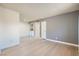 Spacious living room featuring updated floors, light gray walls and utility closet at 4683 Monterey Cir # 4, Las Vegas, NV 89169