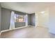 Light-filled living room with large window, fresh paint, and new floors at 4683 Monterey Cir # 4, Las Vegas, NV 89169