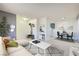 Bright living room featuring modern decor, light floors, and an open layout to the dining area at 4683 Monterey Cir # 4, Las Vegas, NV 89169