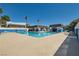 Community pool featuring a large pool, sun loungers, shade and palm trees at 4683 Monterey Cir # 4, Las Vegas, NV 89169