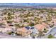 Residential area aerial view with solar panels on roofs, palm trees, and well-maintained yards, capturing a community at 511 Beaconwood St, Henderson, NV 89052