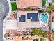 Aerial view of a home with solar panels, a pool, and a well-maintained yard in a residential neighborhood at 511 Beaconwood St, Henderson, NV 89052