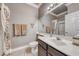 Full bathroom with neutral walls, a framed mirror, and a shower at 511 Beaconwood St, Henderson, NV 89052