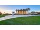 Exterior shot of a community center surrounded by palm trees and open green spaces for recreational activities at 511 Beaconwood St, Henderson, NV 89052