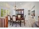 Formal dining area with elegant dark wood table and chairs at 511 Beaconwood St, Henderson, NV 89052