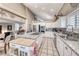 Open kitchen design with island cooktop, stainless appliances, and tile flooring at 511 Beaconwood St, Henderson, NV 89052