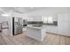 Bright kitchen with white cabinets, granite countertops, stainless steel appliances and tiled flooring at 511 Beaconwood St, Henderson, NV 89052