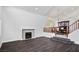 Spacious living room features hardwood flooring, a fireplace, and adjacent dining area at 511 Beaconwood St, Henderson, NV 89052