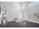 Bright living room features soaring ceilings, lots of natural light, and hardwood flooring at 511 Beaconwood St, Henderson, NV 89052