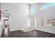 Airy living room boasting soaring ceilings, large windows, and sleek hardwood floors at 511 Beaconwood St, Henderson, NV 89052