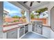 Outdoor kitchen featuring stainless steel appliances, tiled counter, and a covered patio at 511 Beaconwood St, Henderson, NV 89052