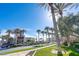 Lush street view of 'The District' with palm trees lining the road and commercial buildings in the background at 511 Beaconwood St, Henderson, NV 89052