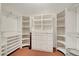 Walk-in closet with custom built-in shelving and drawers for optimal storage at 5224 Painted Lakes Way, Las Vegas, NV 89149