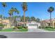 Charming single-story home with a well-manicured lawn and mature palm trees enhancing curb appeal at 5224 Painted Lakes Way, Las Vegas, NV 89149