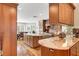 Spacious kitchen features wood cabinets, granite countertops, and stainless steel appliances at 5224 Painted Lakes Way, Las Vegas, NV 89149
