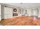 Bright living room with hardwood floors, custom built-ins, fireplace, and ample space for entertaining guests at 5224 Painted Lakes Way, Las Vegas, NV 89149