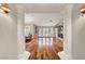 Elegant living room showcasing hardwood floors, fireplace, and large windows for natural light at 5224 Painted Lakes Way, Las Vegas, NV 89149