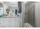 Bathroom features a shower with glass door and white vanity at 5301 River Glen Dr # 205, Las Vegas, NV 89103