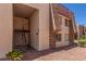 Exterior view of an apartment featuring convenient staircase access and desert landscaping at 5301 River Glen Dr # 205, Las Vegas, NV 89103